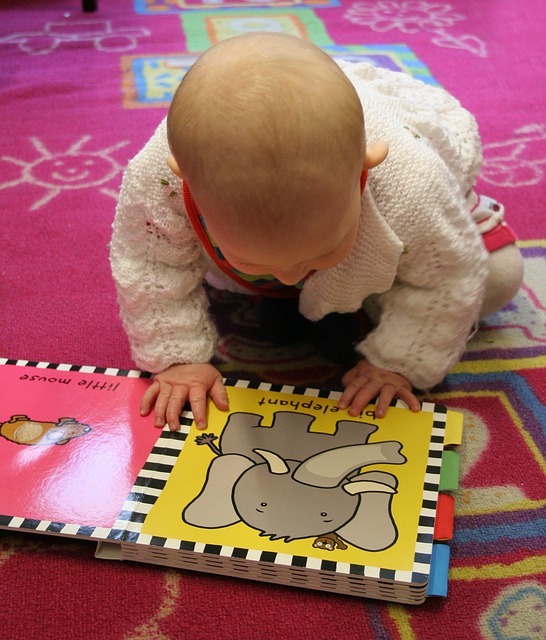 baby looking at book